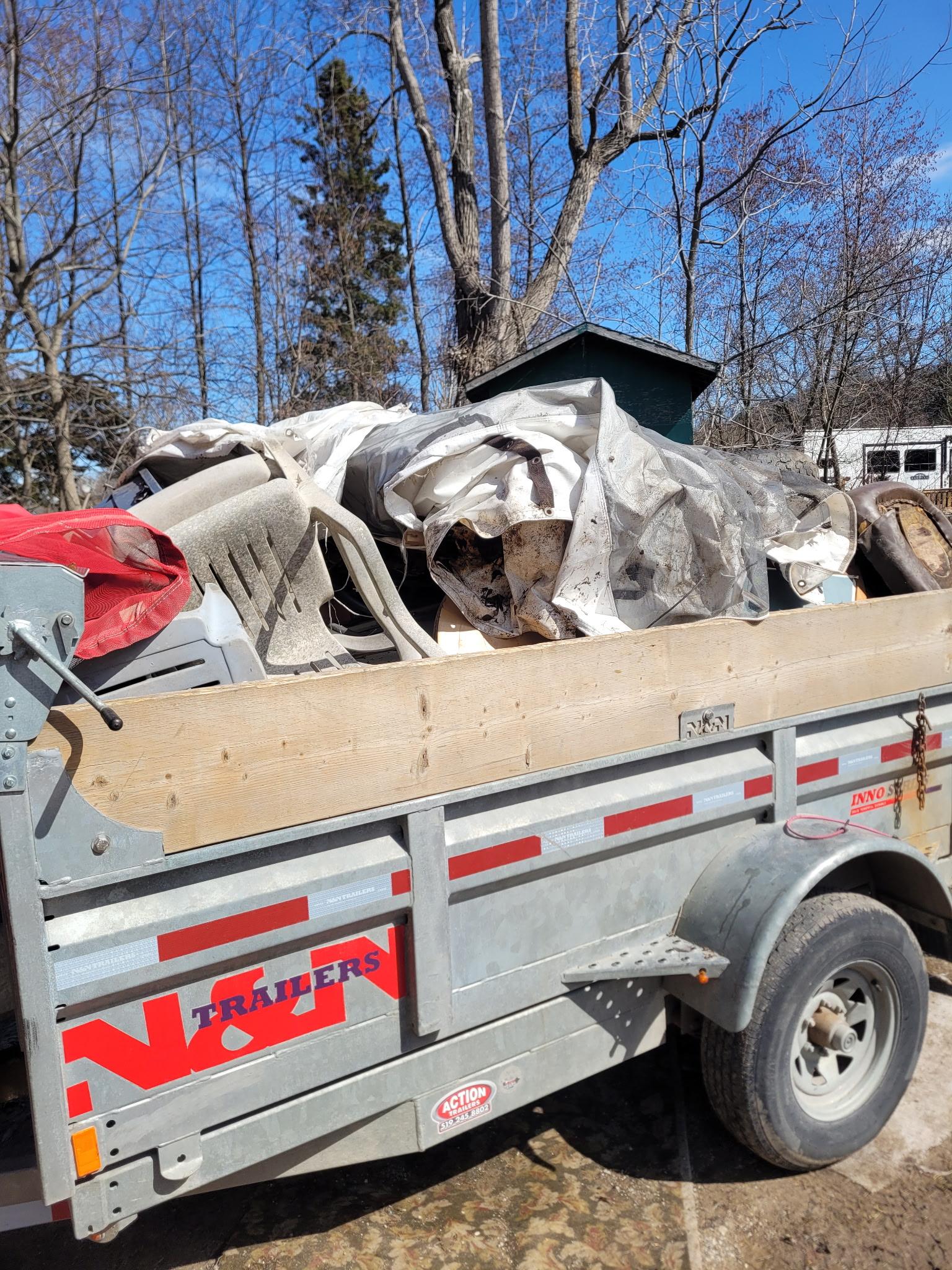Junk to the Dump trailer fully loaded — ready for disposal after a St. Thomas cleanout